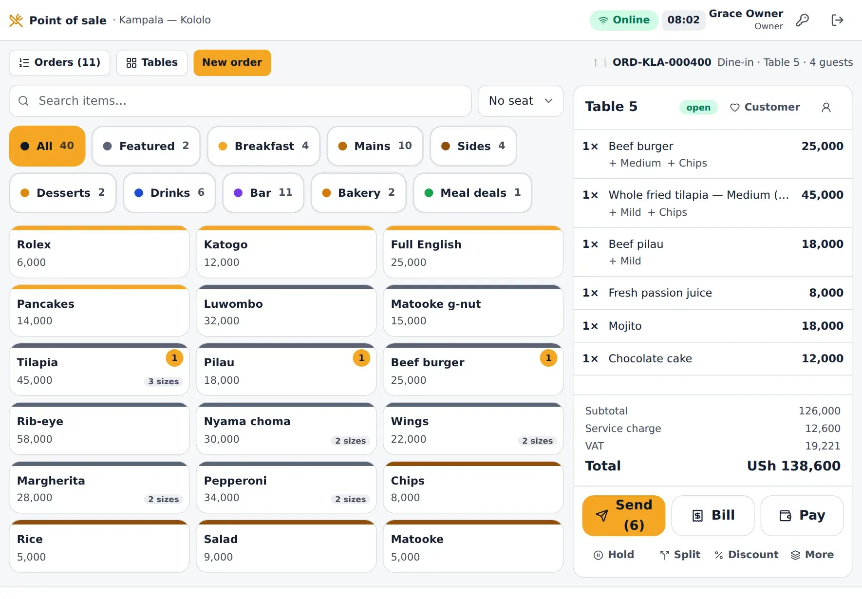 The till: the menu as touch tiles by category and the current order with its VAT and total